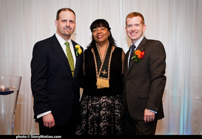 The couple with their officiant