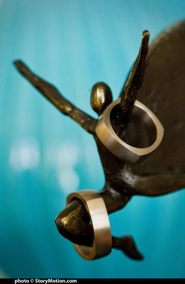 Our wedding rings on an art gift from Pam