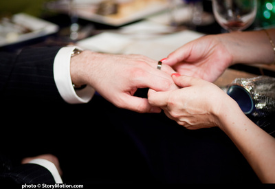 Erica examines Bill's ring