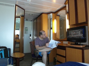 Bill reviews the day's agenda in the Cruise Compass