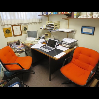 Dad's private office with the orange Knoll office armchairs designed by Charles Pollock