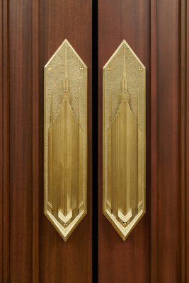 The metal plates on many of the doors depict the temple.