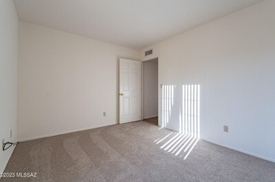 Front bedroom standing at the window